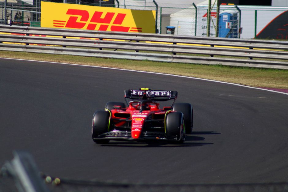 Dynamic shot of McLaren and Ferrari cars racing side by side in 2026 F1 season