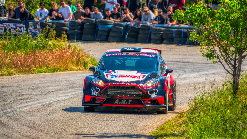 Podium celebration, tire marks, blurred speed effect, dynamic composition