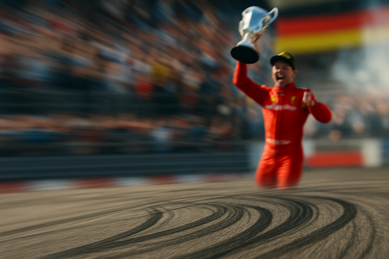Podium celebration, close-up of tire marks, speed blur