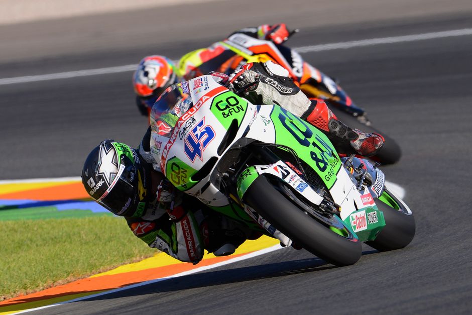 Team reactions and pit lane activity in MotoGP