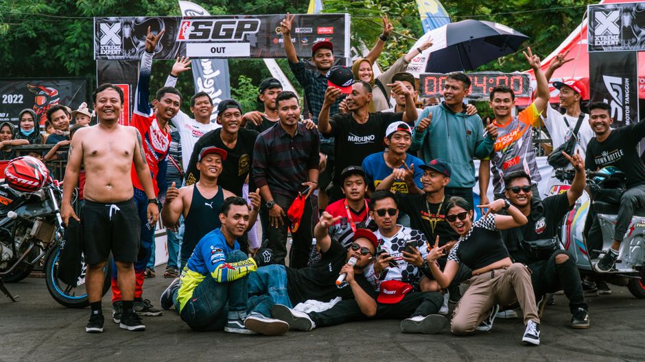 Podium celebration, tire marks, speed blur